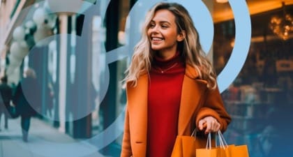 Woman with Orange Shopping Bags and Coat Smiling