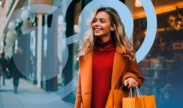 Woman with Orange Shopping Bags and Coat Smiling
